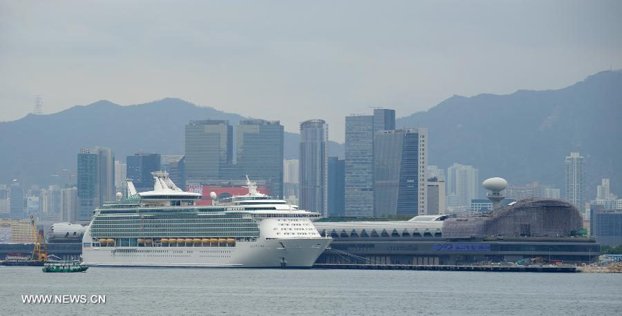 Cruise liner Mariner of the Seas is berthed at the Kai Tak Cruise Terminal in Hong Kong, south China, June 13, 2013. The new cruise terminal, built at the end of the runway of the former Kai Tak Airport, received its first liner, Mariner of the Seas on June 12, which has a capacity of 3,807 people. (Xinhua/Lui Siu Wai)