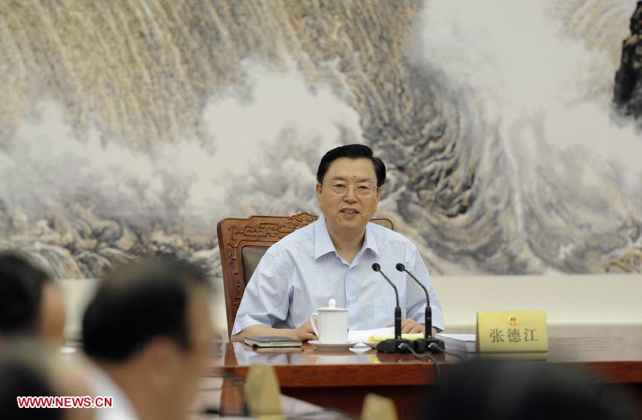 Zhang Dejiang, chairman of China's National People's Congress (NPC) Standing Committee, presides over the fifth meeting of the chairman and vice chairpersons of the 12th NPC Standing Committee at the Great Hall of the People in Beijing, capital of China, June 14, 2013. (Xinhua/Xie Huanchi)  