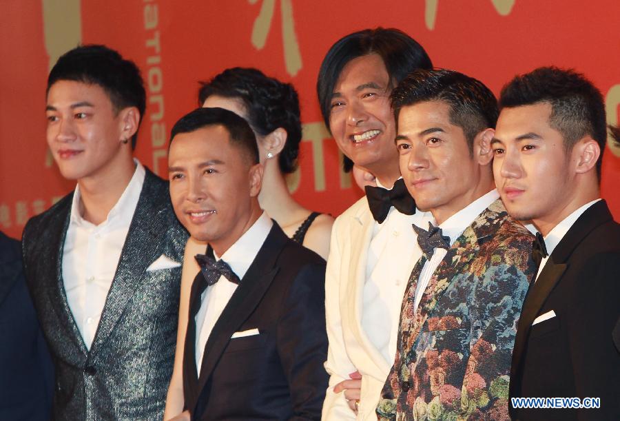 Movie stars (4th R) Donnie Yen, Chow Yun-fat (3rd R) and Aaron Kwok (2nd R) pose on the red carpet for the opening ceremony of the 16th Shanghai International Film Festival in Shanghai, east China, June 15, 2013. (Xinhua/Pei Xin)