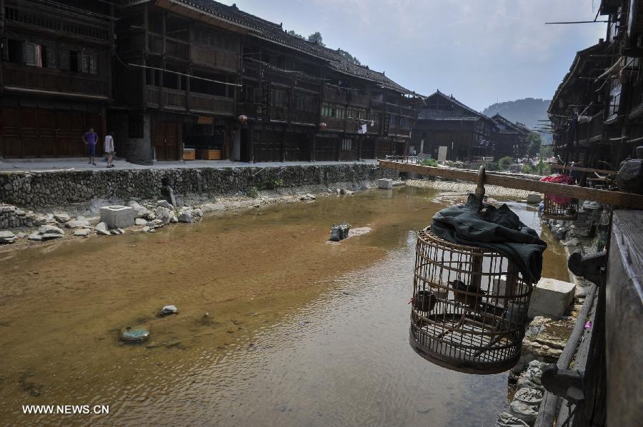 Photo taken on June 20, 2013 shows the scenery of Zhaoxing Dong Village in Liping County, southwest China's Guizhou Province. Zhaoxing Dong Village is one of the largest Dong village in Guizhou. In 2005, it was ranked one of China's six most beautiful villages and towns by Chinese National Geography. (Xinhua/Ou Dongxu) 