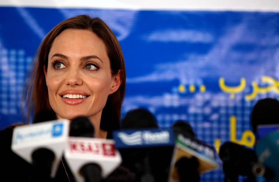 Actress Angelina Jolie, the U.N. refugee agency's special envoy, speaks to the media during a news conference at the Al Zaatri refugee camp, in the Jordanian city of Mafraq, near the border with Syria, June 20, 2013, the World Refugee Day. The refugee camp is hosting Syrians displaced by the country's domestic conflict. (Xinhua/Mohammad Abu Ghosh) 