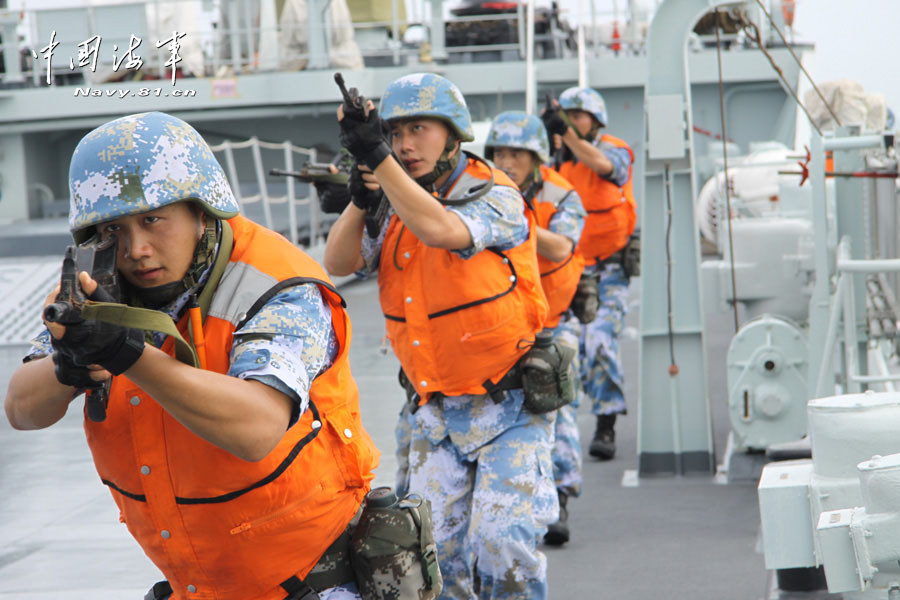 A special operation detachment under a marine brigade of the Chinese People's Liberation Army Navy (PLAN) conducts a joint escorting training with a landing ship flotilla of the PLAN on the high-risk subjects, such as climbing boarding, cabin search, sea blockade and arresting pirates. (China Military Online/ Sun Haichao and Jiang Zhengyuan)