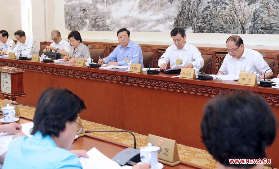 Committee members review the draft on the safety law of special equipment during the meeting of the third session of the 12th National People's Congress (NPC) Standing Committee in Beijing, capital of China, June 26, 2013. Zhang Dejiang (3rd R, back), chairman of the NPC Standing Committee, attended the meeting.(Xinhua/Zhang Duo)