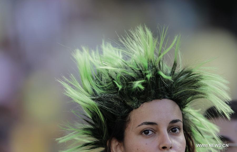 A fan reacts prior to the FIFA's Confederations Cup Brazil 2013 semifinal match between Spain and Italy held at Castelao Stadium in Fortaleza, Brazil, on June 27, 2013. Spain won the match 7-6 in a penalty shoot-out. (Xinhua/Guillermo Arias)