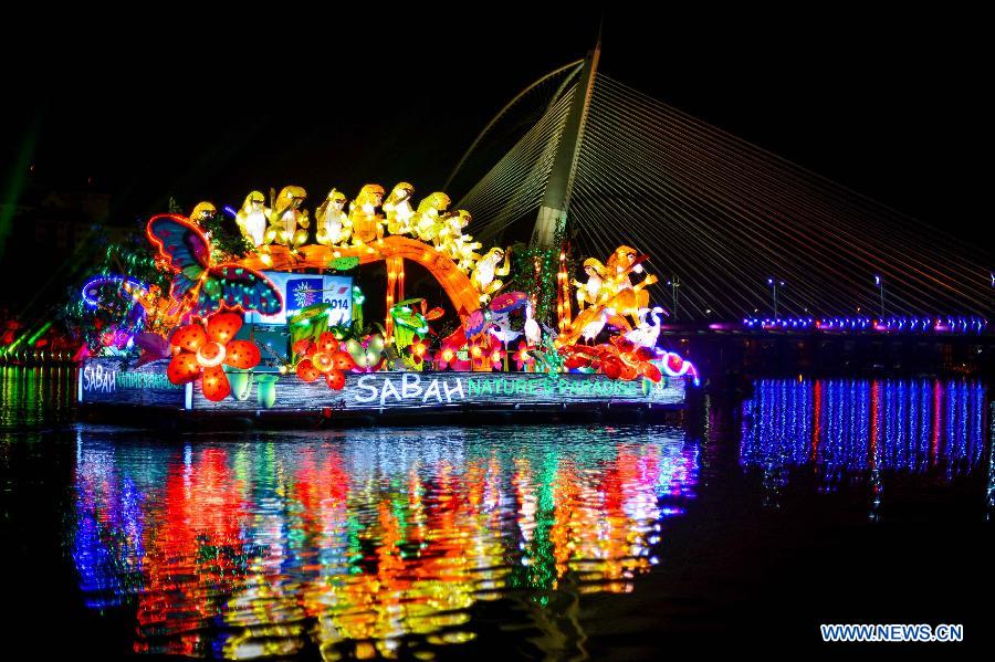Float of Sabah State attends the night parade activity in Putrajaya, Malaysia, June 30, 2013. A total of 14 floats attend a night parade activity here on Sunday.(Xinhua/Chong Voon Chung)