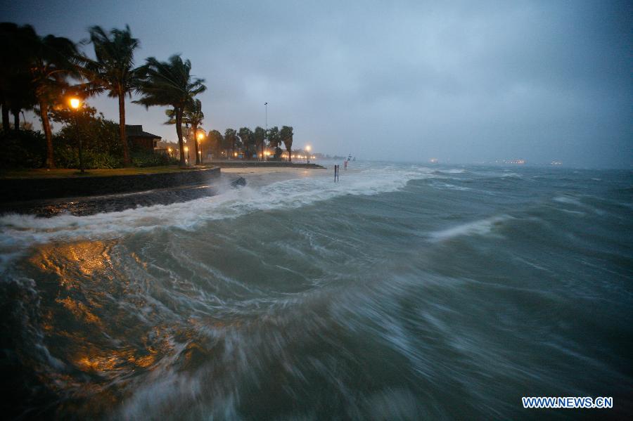 Photo taken on July 2, 2013 shows the surged waves stired up by the tropical storm Rumbia in Zhanjiang, south China's Guangdong Province. Tropical storm Rumbia landed on Zhenjiang on Tuesday morning and brought torrential rain and gales to some areas in Guangdong Province. (Xinhua/Liang Zhiwei)
