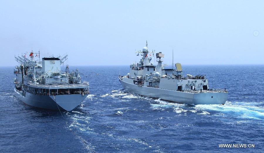 The destroyer Shenyang and comprehensive supply ship Hongze Lake are seen during Sino-Russian joint naval drills held in the sea of Japan, July 4, 2013. (Xinhua/Wang Dongming) 