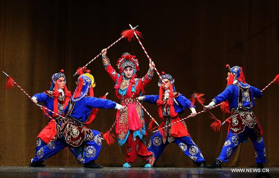 Chinese artists perform Beijing Opera at the National Theater in Algiers, capital of Algeria, July 8, 2013. The performance was part of the celebrations to mark the 55th anniversary of the establishment of the diplomatic relations between China and Algeria. (Xinhua/Mohamed Kadri)