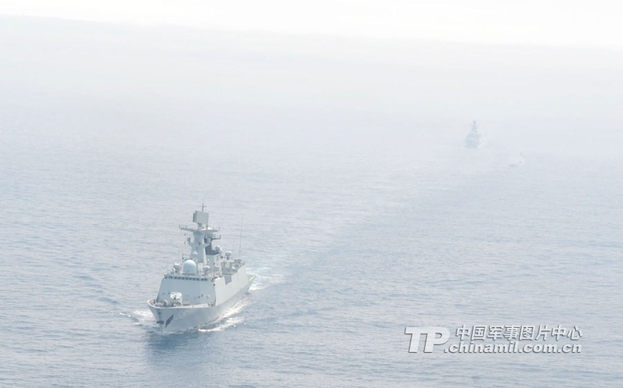 Chinese and Russian warships participating in the China-Russia "Joint Sea-2013" joint naval drill conduct joint escort drill in a designated exercise sea area on July 9, 2013. (China Military Online/Sun Yang) 