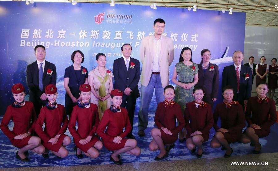 Yao Ming (C), former Chinese basketball superstar and goodwill ambassador for the U.S. city of Houston, attends the Air China Beijing-Houston Inaugural Flight ceremony in Beijing, China, July 11, 2013. Air China, China's flagship air carrier, launched nonstop flights between Beijing and Houston on July 11, and is scheduled to operate four roundtrip flights every week. (Xinhua/Fu Qi) 