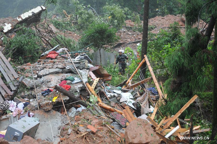 Photo taken on July 11, 2013 shows ruins after a mudslide at the Sanxi Village, in Dujiangyan City, southwest China's Sichuan Province. As of 2:10 p.m. Thursday, rescuers had found 18 bodies from the landslide that happened on Wednesday morning in the village of Sanxi. (Xinhua/Xue Yubin)