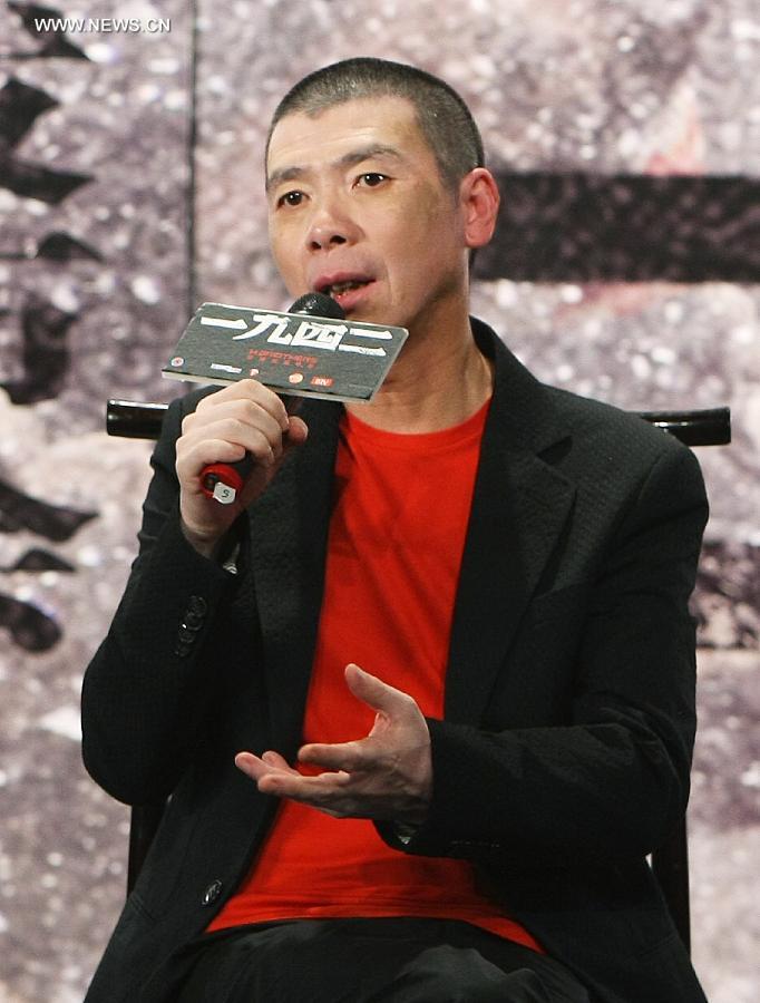 File photo taken on Aug. 16, 2012 shows director Feng Xiaogang talking about his work "back to 1942", a movie on the great famine that struck central China's Henan Province in 1942, at a press conference. Feng will be the general director of China Central Television (CCTV)'s 2014 Spring Festival Gala, CCTV announced on July 12, 2013. Zhao Benshan, a well-known comedian, will be deputy general director in charge of the gala's comedy programming. (Xinhua)