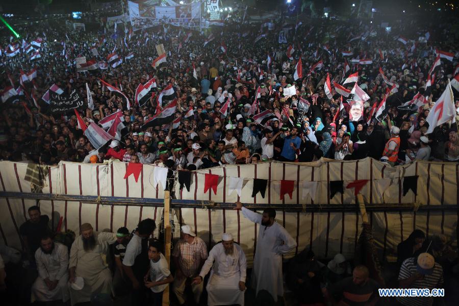Supporters of ousted Egyptian President Mohamed Morsi attend a protest near the Rabaa al-Adawiya mosque, in Cairo, Egypt, July 12, 2013. (Xinhua/Wissam Nassar) 