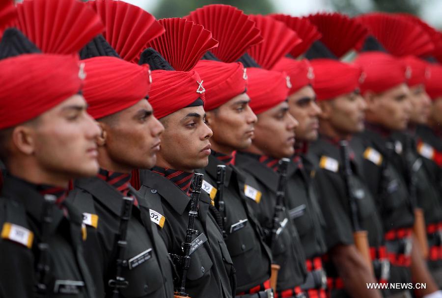 New recruits of Indian army take part in a passing out parade at an army base on the outskirts of Srinagar, the summer capital of Indian-controlled Kashmir, July 10, 2013. The 494 recruits from Indian-controlled Kashmir were formally inducted into the Indian army's Jammu Kashmir Light Infantry (JAKLI) regiment after rigorous training. (Xinhua/Javed Dar)