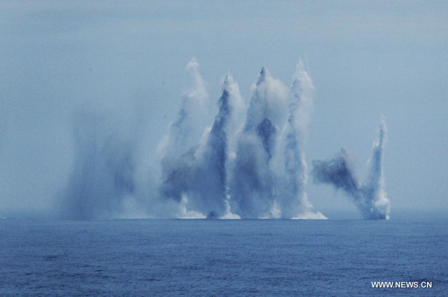 Chinese naval vessel fire anti-submarine missile during the "Joint Sea-2013" drill at Peter the Great Bay in Russia, July 10, 2013. The "Joint Sea-2013" drill participated by Chinese and Russian warships concluded here on Wednesday. (Xinhua/Zha Chunming)