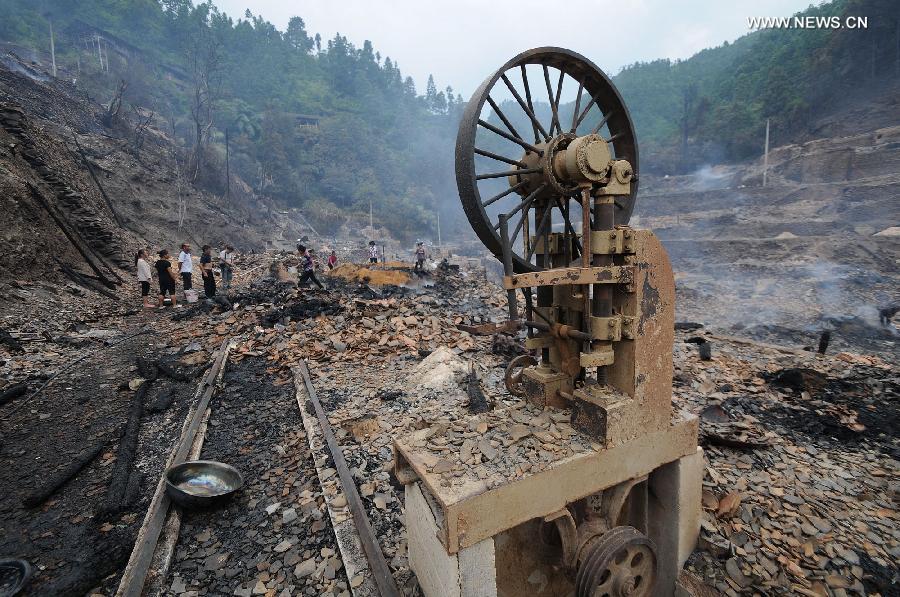 Photo taken on July 16, 2013 shows the accident site in Wusuo Village of Miao ethnic group of Taijiang County, southwest China's Guizhou Province. A fire caused the burnout of more than 200 houses on Monday afternoon with no casualties report. (Xinhua)