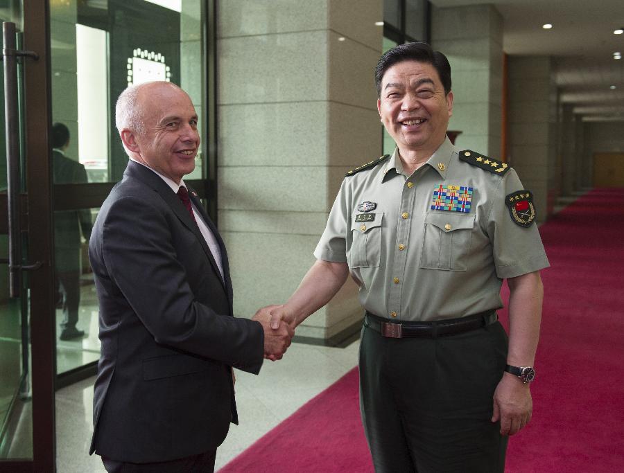 Chinese State Councilor and Defense Minister Chang Wanquan (R) meets with Swiss President Ueli Maurer in Beijing, capital of China, July 18, 2013. Maurer is in China to attend the Eco-Forum Global in Guiyang, capital of southwest China's Guizhou Province. (Xinhua/Xie Huanchi)