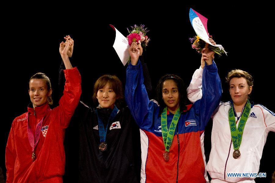 (From L to R) Silver medalist Ana Zaninovic of Croatia, gold medalist Yu-Jin Kim of South Korea and bronze medal winners Yamisel Nunez of Cuba and Floriane Liborio of France pose during the awarding ceremony of the final of the 53 kg women's category of the Taekwondo World Championship of the World Taekwondo Federation (WTF), at the Expositions and Coventions Center of Puebla, in Puebla, Mexico, on July 18, 2013. (Xinhua/Guillermo Arias)
