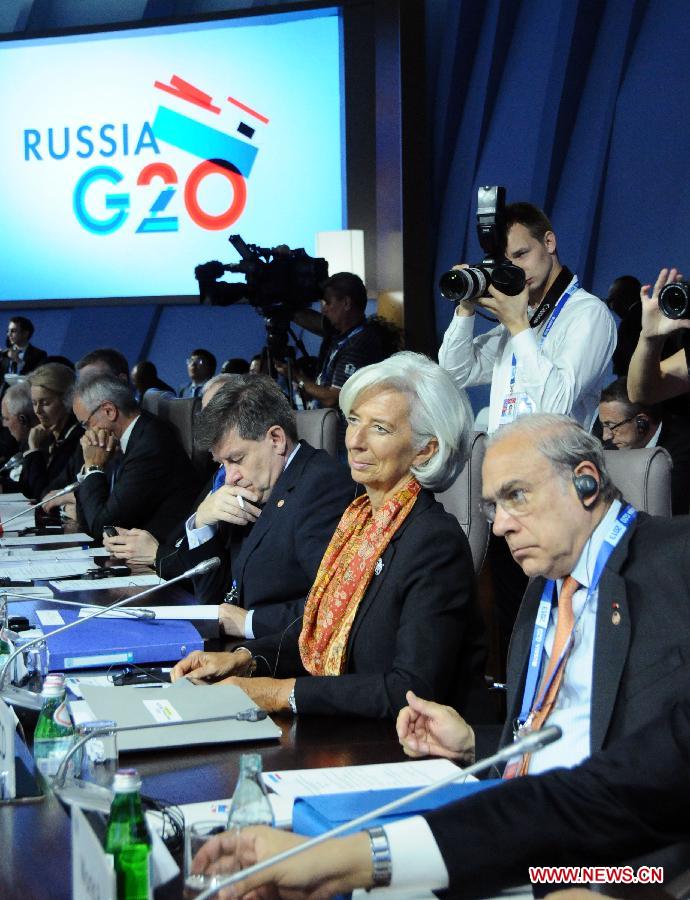 Christine Lagarde (2nd R), the Managing Director of International Monetary Fund (IMF), attends the Group of Twenty (G20) Finance and Labor Ministers Meeting of G20 finance ministers and central bank governors' meetings in Moscow, Russia, July 19, 2013. The G20 finance ministers and central bank governors' meetings was kicked off in Moscow on Friday (Xinhua/Ding Yuan)