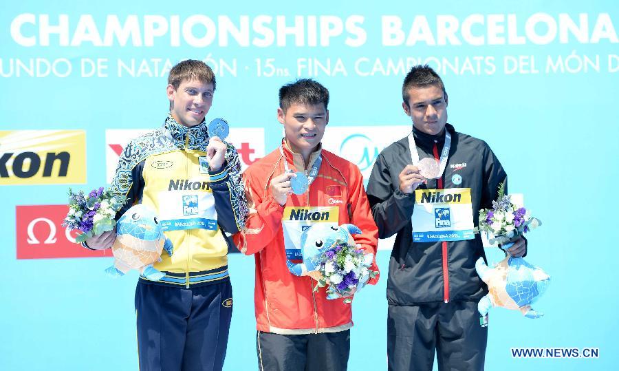 Medallists celebrate during the awarding ceremony for the men's 1m springboard in the World Swimming Championships in Barcelona, Spain, on July 22, 2013. China's Li Shixin won the gold with 460.95 points. (Xinhua/Guo Yong)