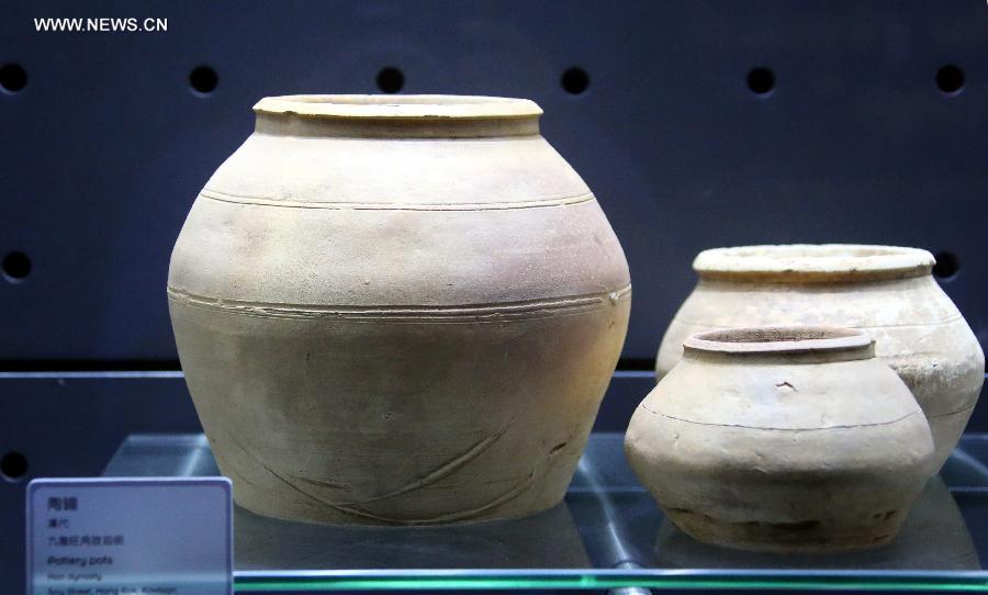 Photo taken on July 27, 2013 shows pottery jars of the Han Dynasty (202 B.C. - A.D. 220) at the Hong Kong Heritage Discovery Centre in Hong Kong, south China. By occupying and restoring the historic building of a former British barrack, the centre has opened to the public since 2005 for antiquities exhibition and education use. (Xinhua/Li Peng) 