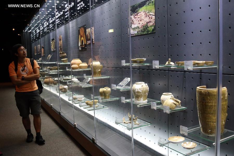A visitor views items displayed at the Hong Kong Heritage Discovery Centre in Hong Kong, south China. By occupying and restoring the historic building of a former British barrack, the centre has opened to the public since 2005 for antiquities exhibition and education use. (Xinhua/Li Peng) 